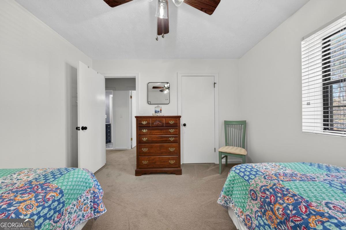 219 Hickory Pass Sparta, GA 31087 - Photo 33 of 62 a bedroom with a bed and a cabinets