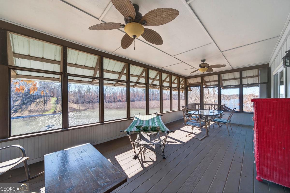 219 Hickory Pass Sparta, GA 31087 - Photo 37 of 62 a living room with furniture large window and wooden floor