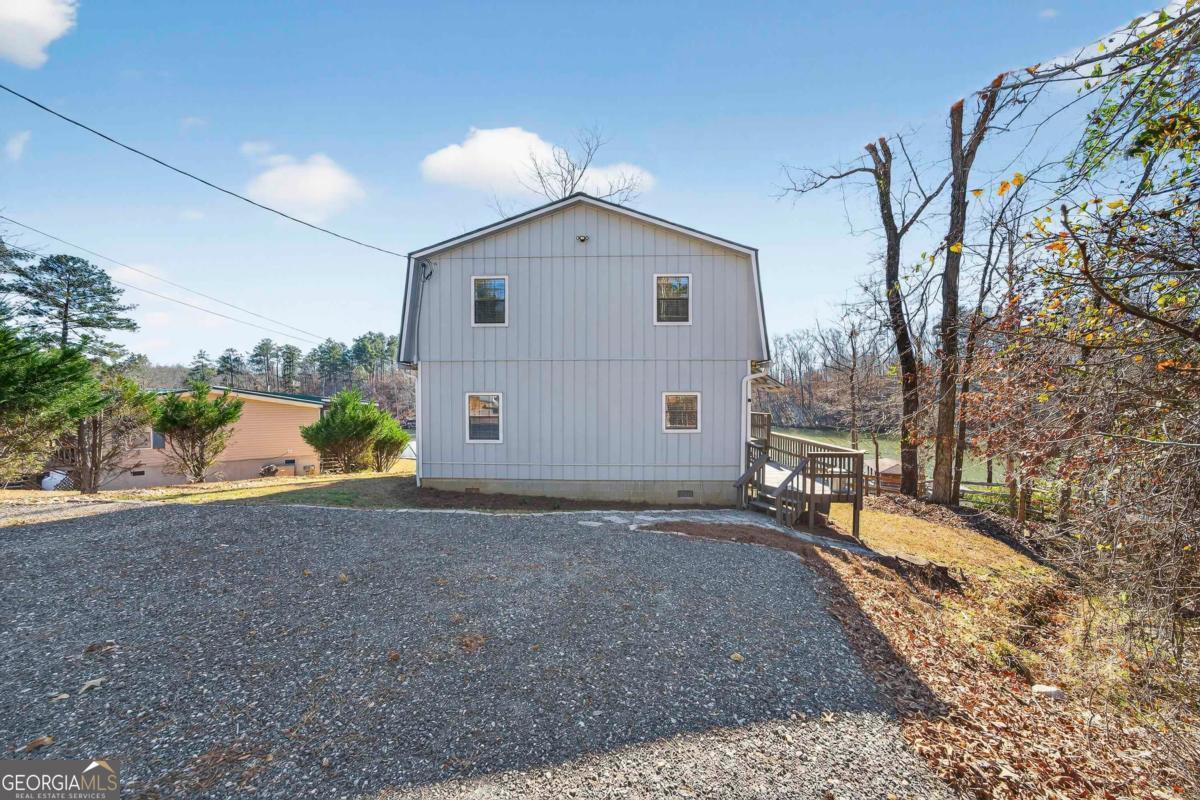 219 Hickory Pass Sparta, GA 31087 - Photo 39 of 62 a view of a house with a backyard and a tree