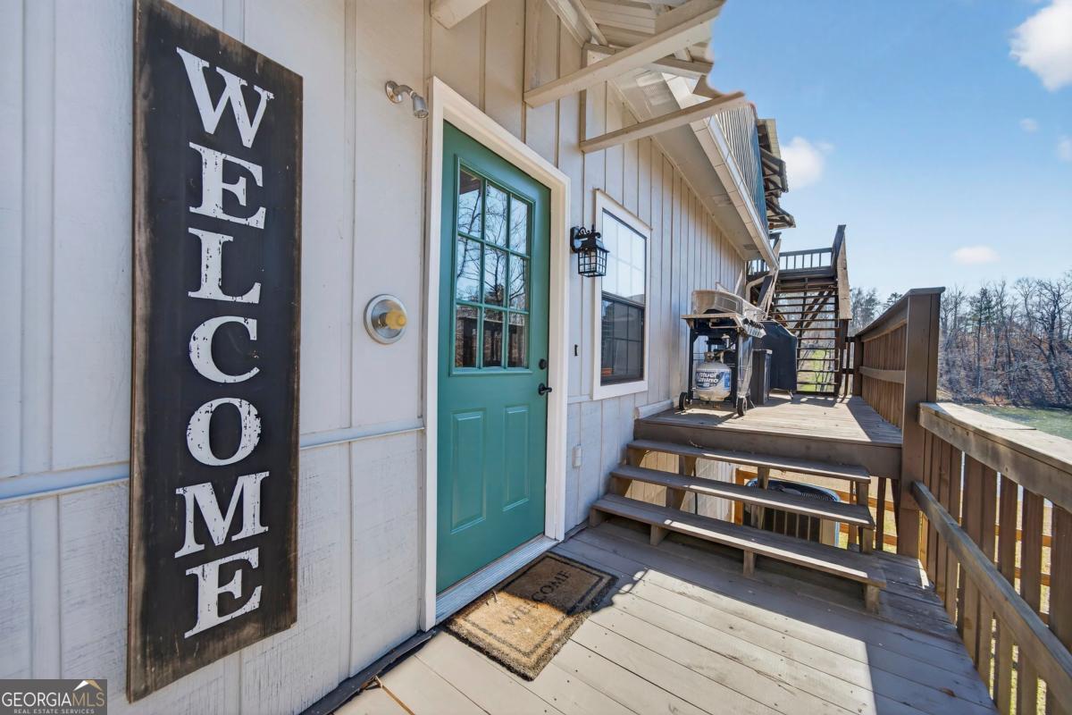 219 Hickory Pass Sparta, GA 31087 - Photo 5 of 62 a view of outdoor space deck and living room