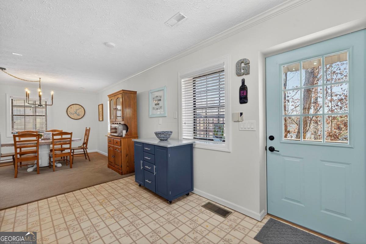 219 Hickory Pass Sparta, GA 31087 - Photo 10 of 62 a bedroom with furniture and a window