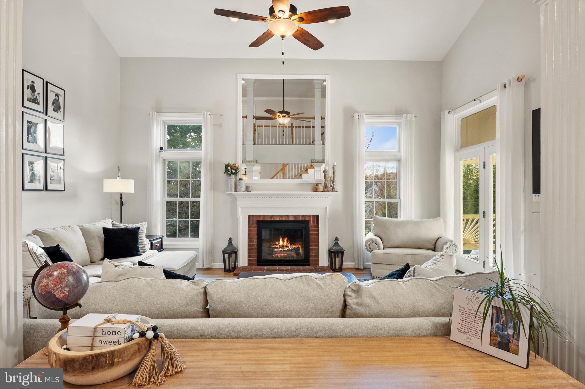 9916 Founders Way Damascus, MD 20872 - Photo 11 of 53 a living room with furniture and a fireplace