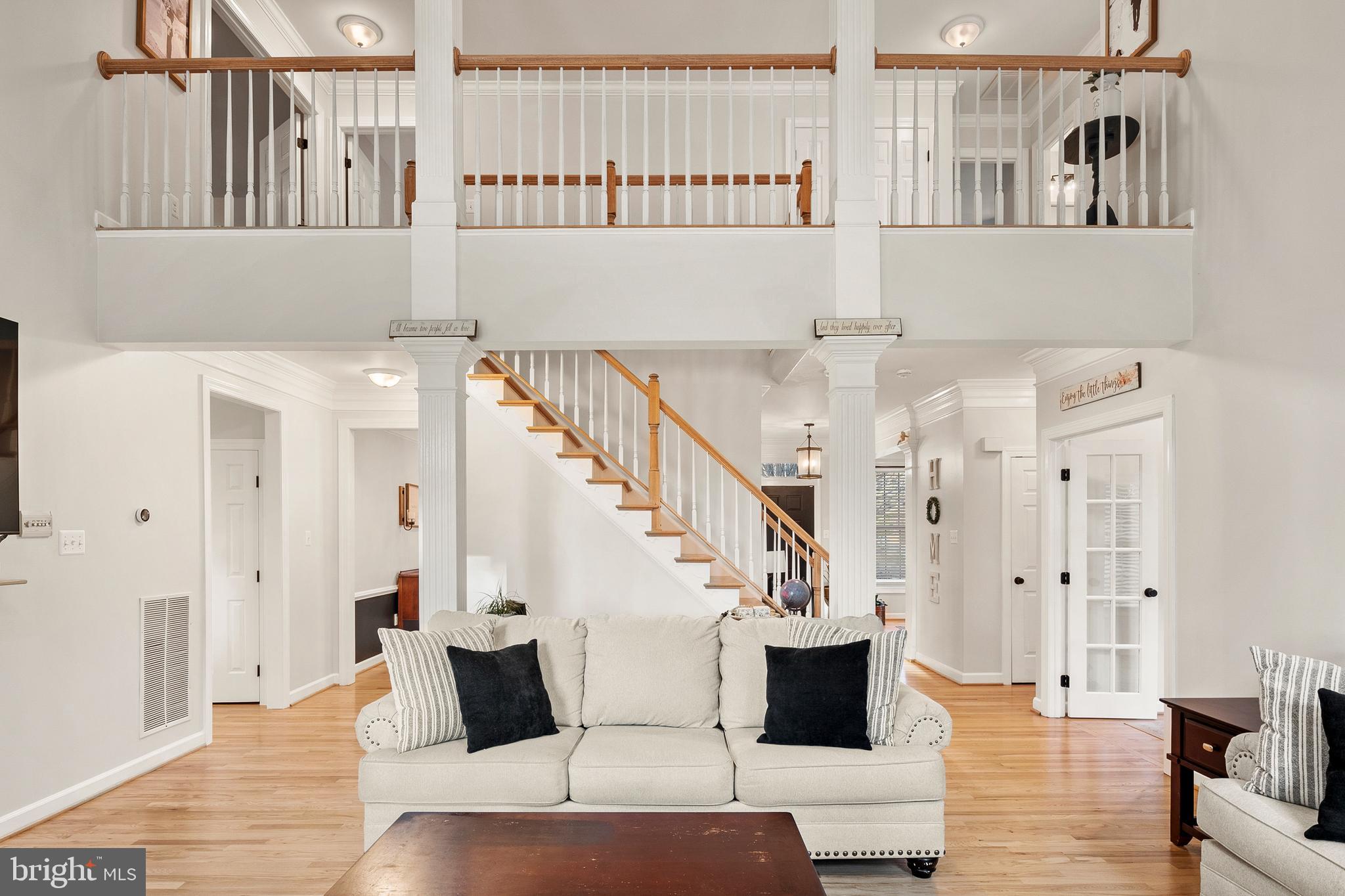 9916 Founders Way Damascus, MD 20872 - Photo 12 of 53 a living room with furniture and a wooden floor