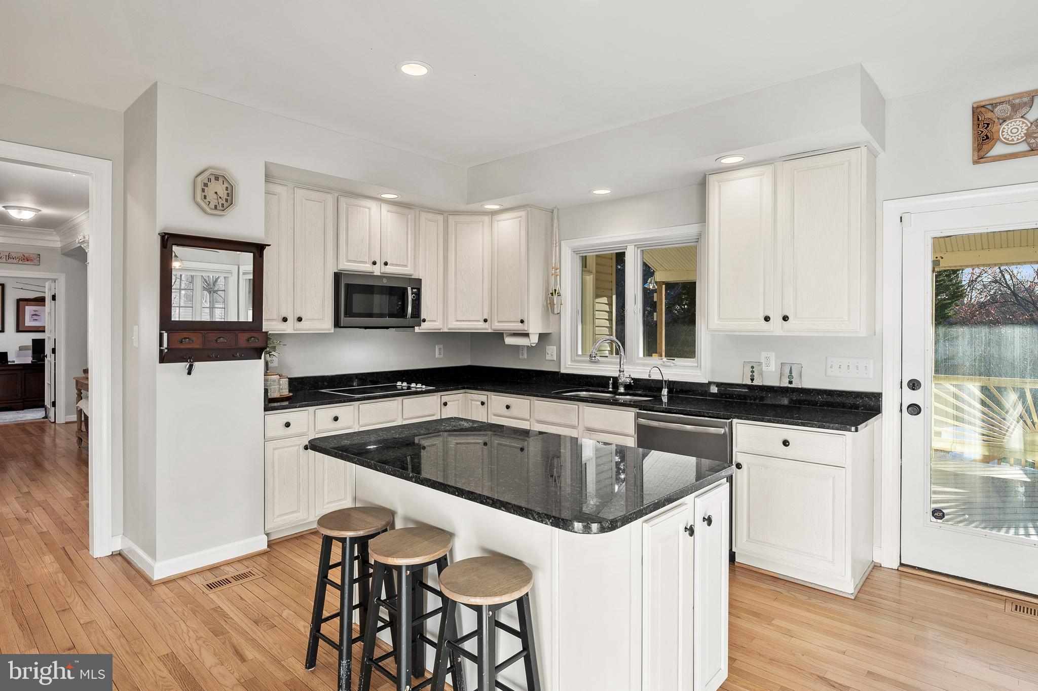 9916 Founders Way Damascus, MD 20872 - Photo 15 of 53 a kitchen that has a sink and a stove top oven