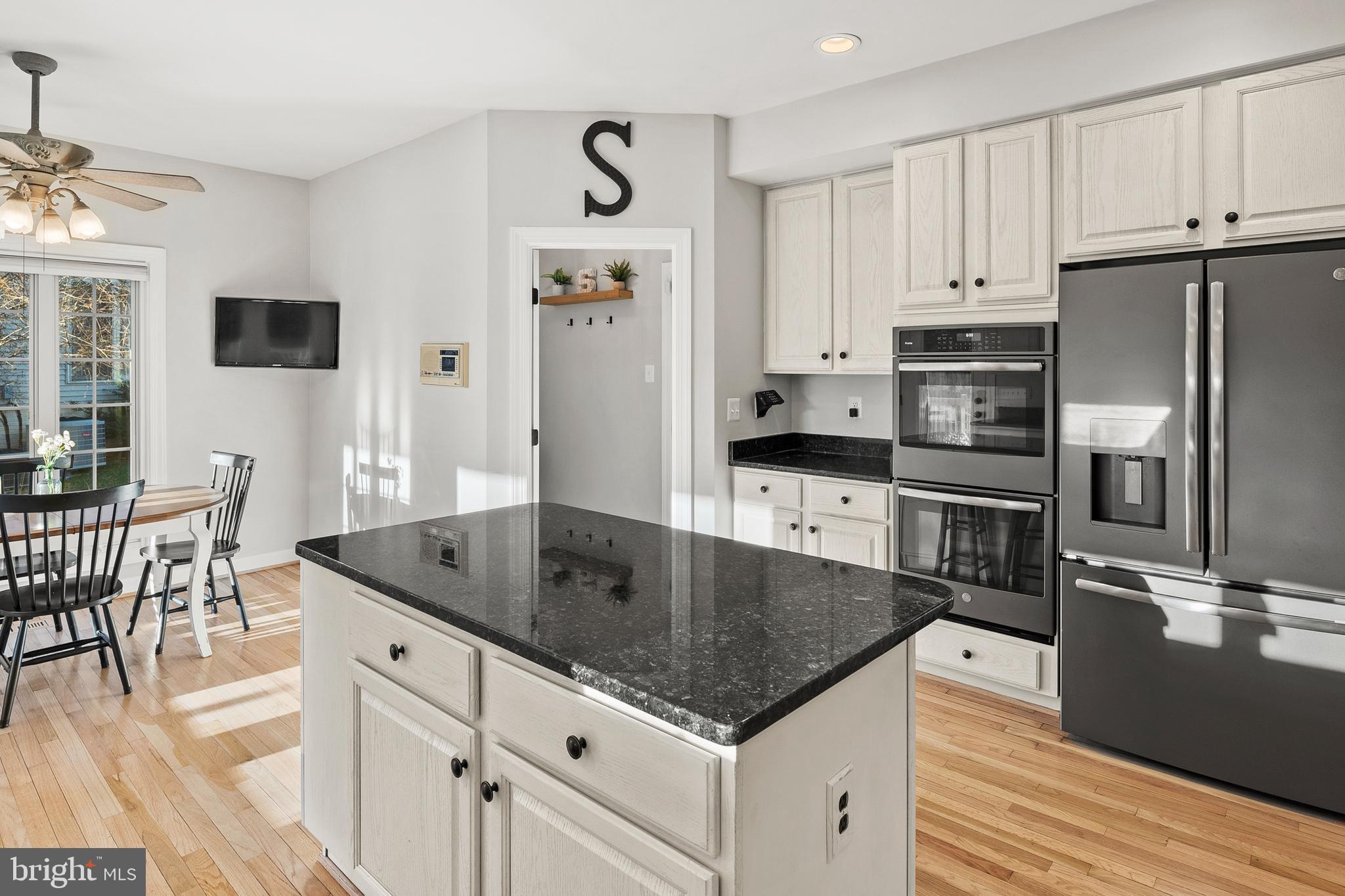 9916 Founders Way Damascus, MD 20872 - Photo 17 of 53 a kitchen with stainless steel appliances granite countertop a sink a stove and a refrigerator