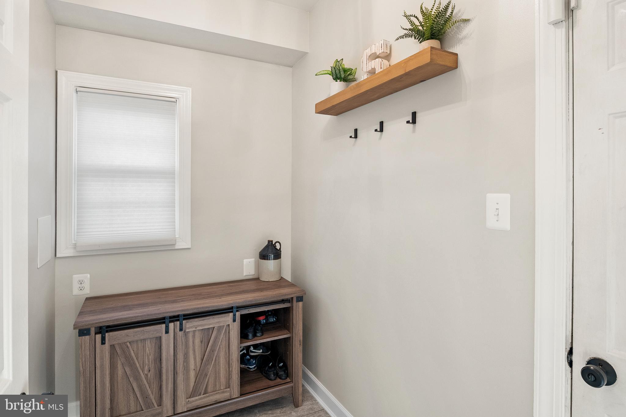 9916 Founders Way Damascus, MD 20872 - Photo 23 of 53 a view of storage and utility room with wooden floor