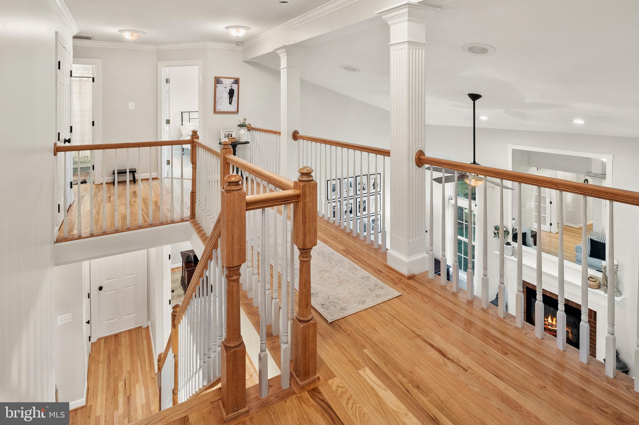 9916 Founders Way Damascus, MD 20872 - Photo 25 of 53 a view of a hallway with wooden floor and staircase