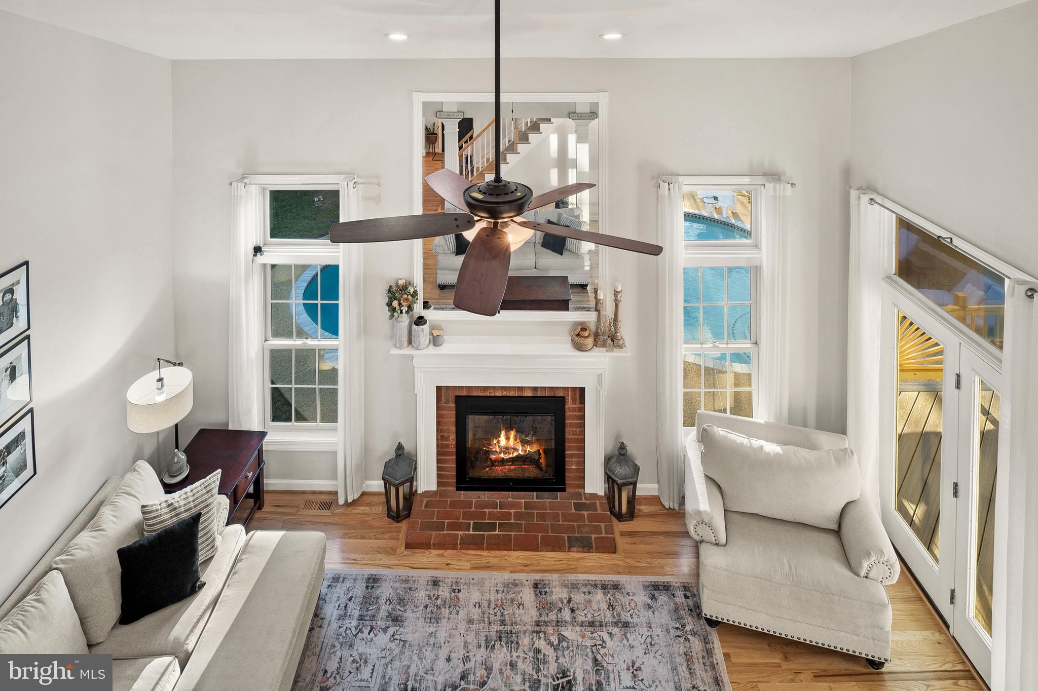 9916 Founders Way Damascus, MD 20872 - Photo 27 of 53 a living room with furniture and a fireplace