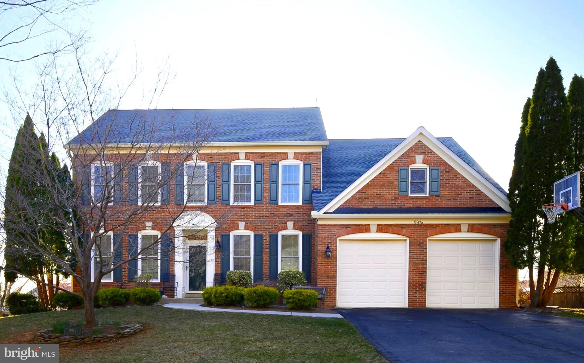 9916 Founders Way Damascus, MD 20872 - Photo 3 of 53 a front view of residential houses with yard and green space