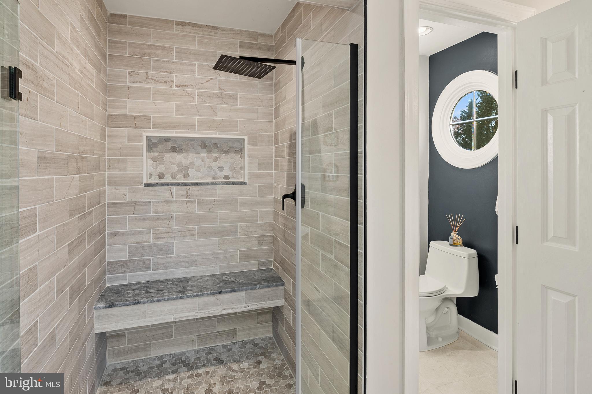 9916 Founders Way Damascus, MD 20872 - Photo 33 of 53 a bathroom with a shower and mirror