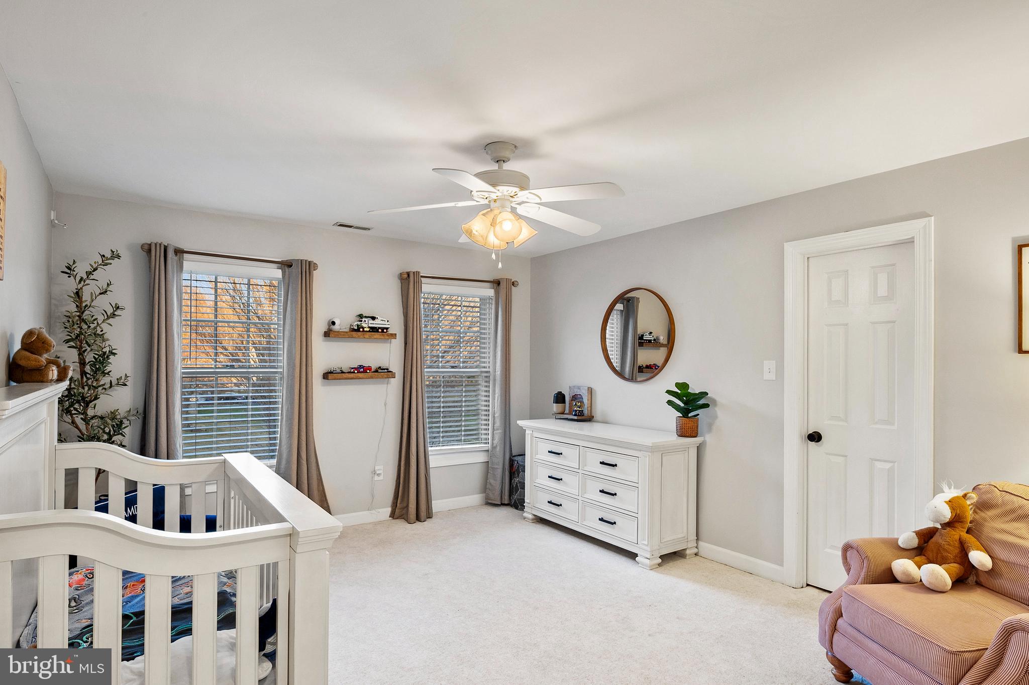 9916 Founders Way Damascus, MD 20872 - Photo 38 of 53 a living room with furniture and a chandelier