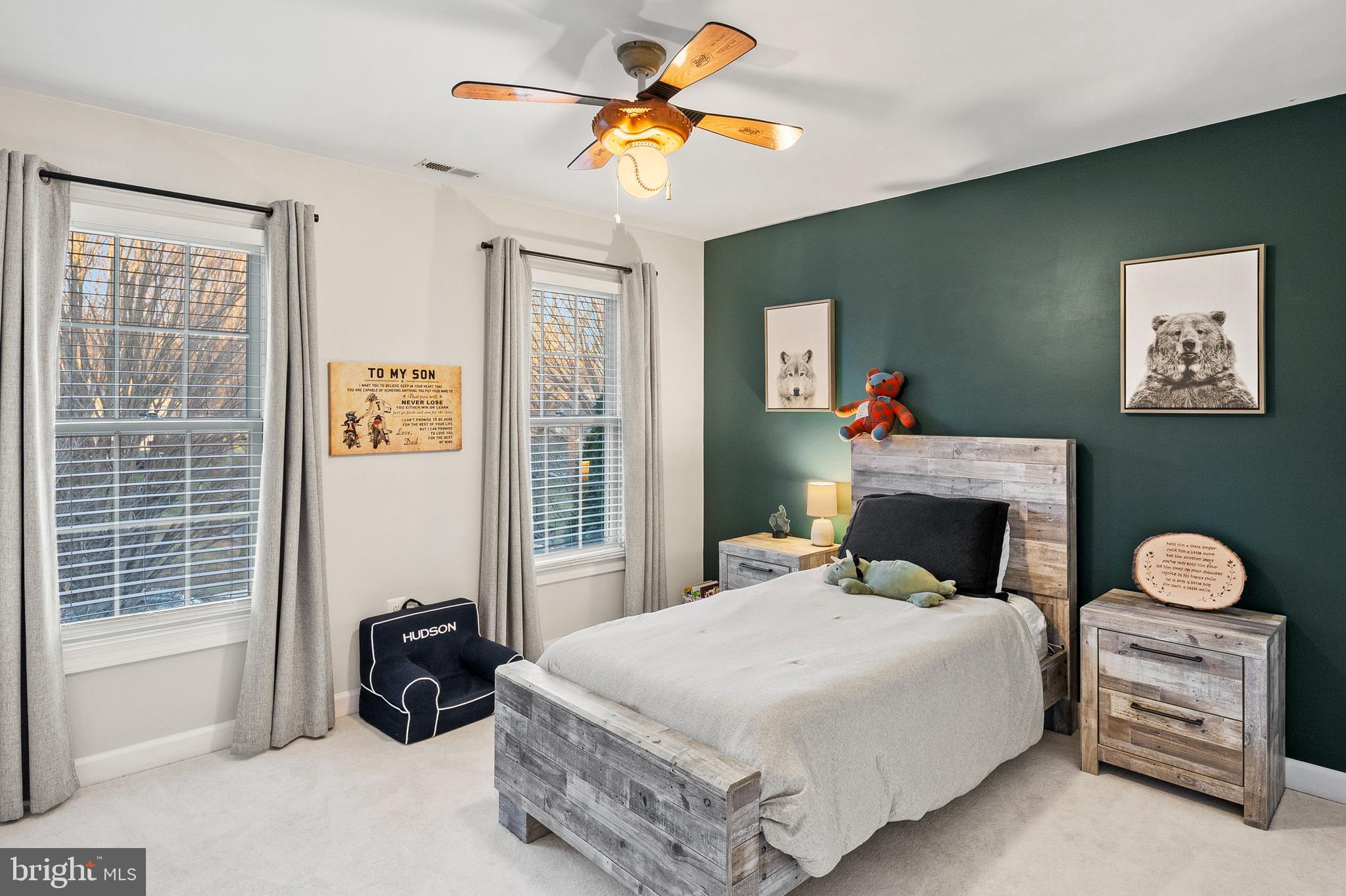 9916 Founders Way Damascus, MD 20872 - Photo 39 of 53 a bedroom with a bed and a chandelier