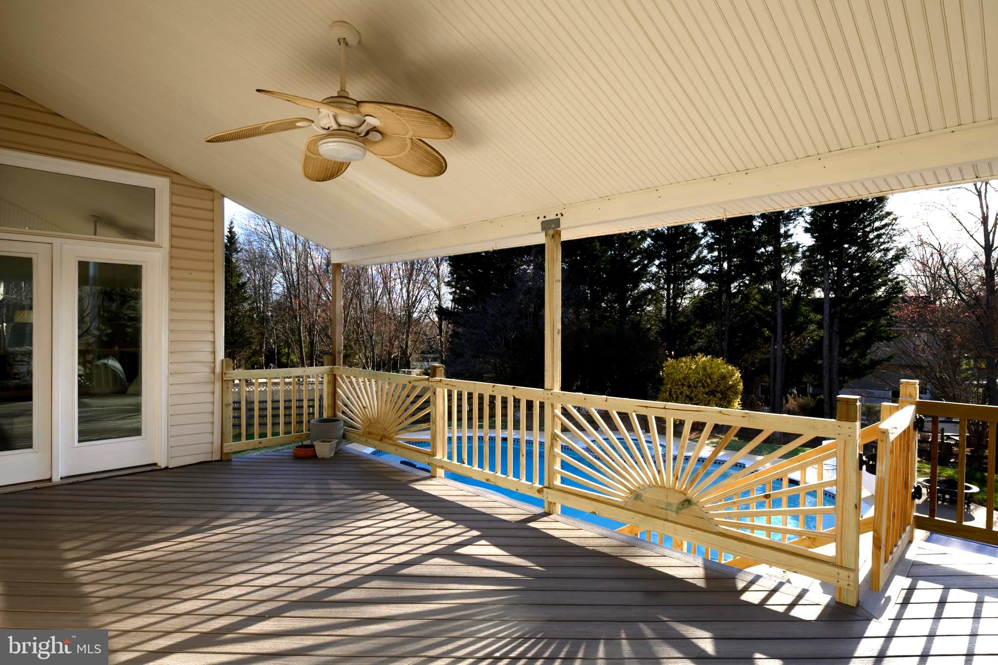 9916 Founders Way Damascus, MD 20872 - Photo 46 of 53 a view of a roof deck with couches chairs and wooden floor