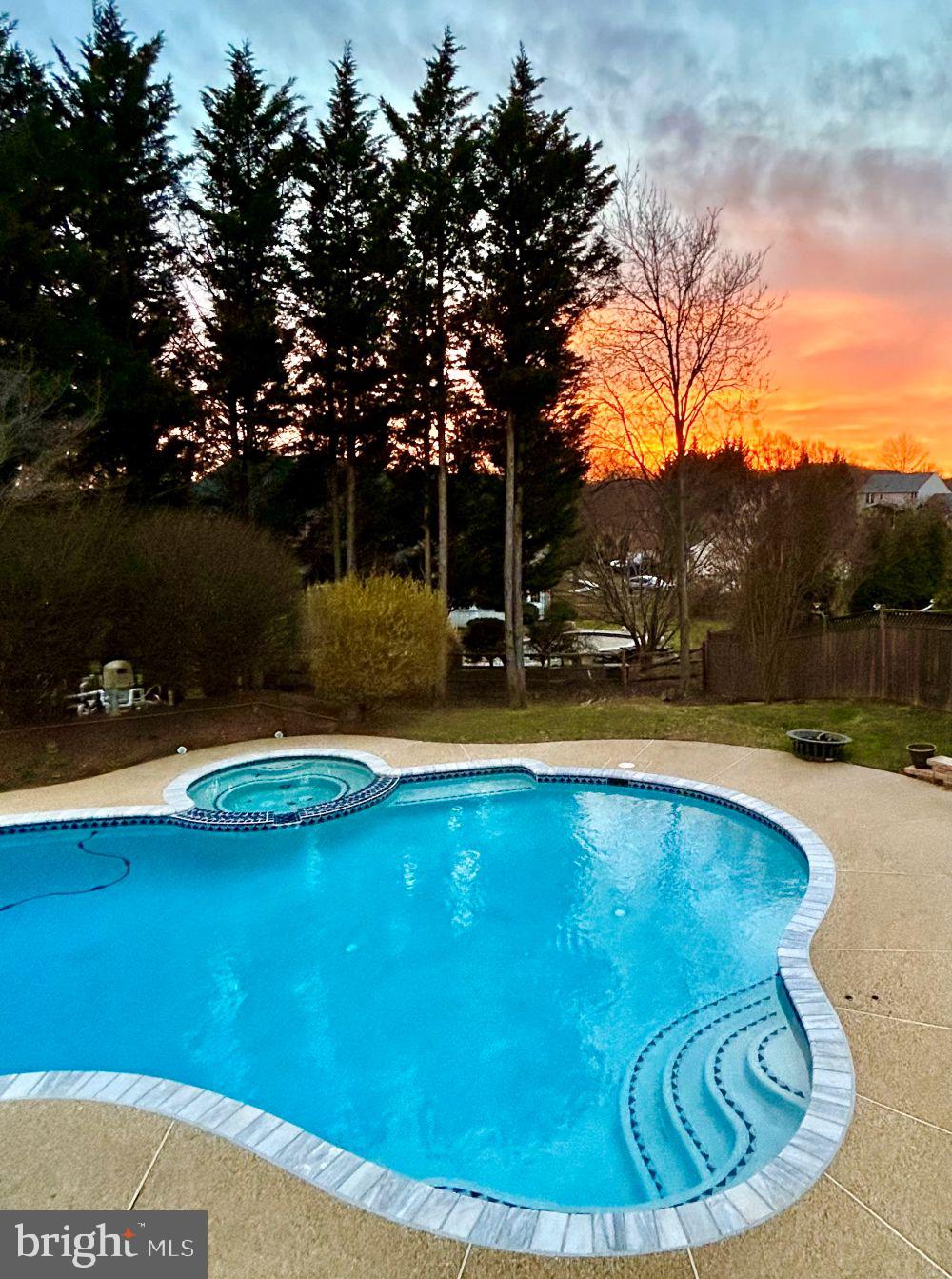 9916 Founders Way Damascus, MD 20872 - Photo 53 of 53 a view of a swimming pool with an outdoor space and seating area