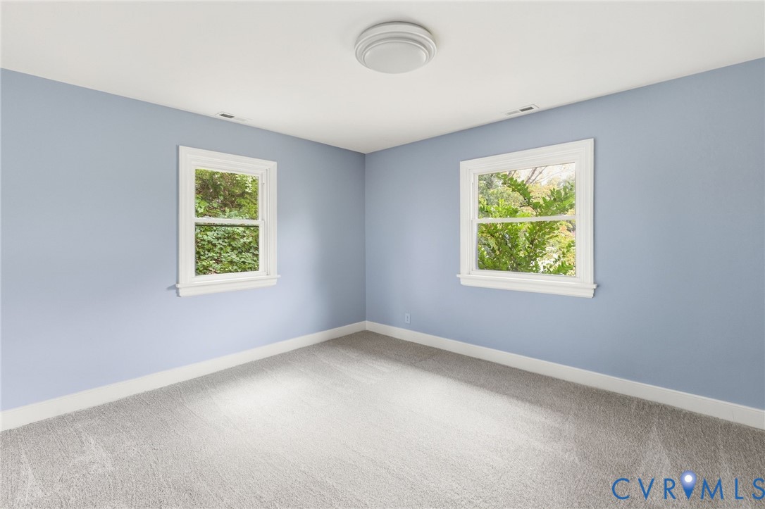 5901 Bonneau Road Richmond, VA 23227 - Photo 15 of 21 Light blue painted walls, grey carpet flooring, wh