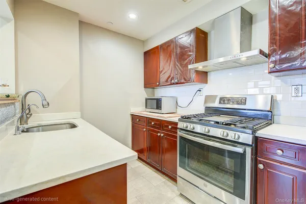 a kitchen with stainless steel appliances granite countertop a stove and a sink