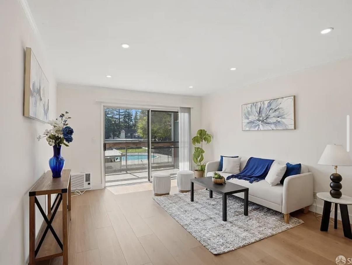 4081 Clayton Road, Unit 235 Concord, CA 94521 - Photo 7 of 19 a living room with furniture and a potted plant