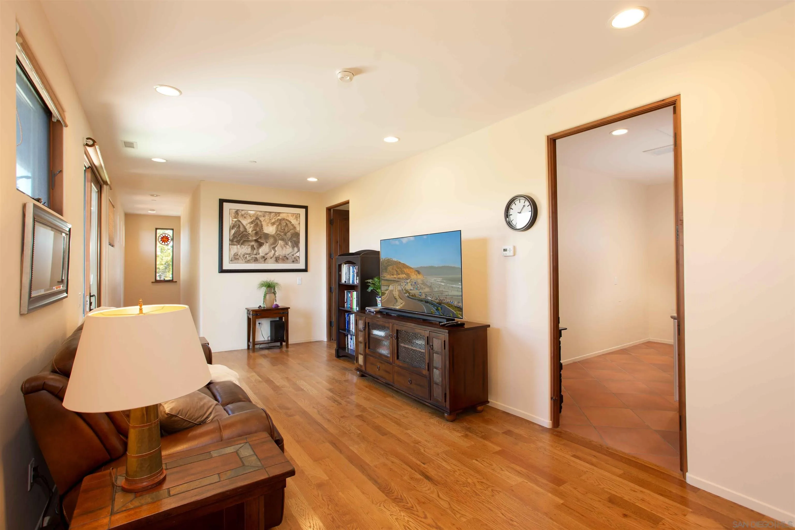 2624 Lone Jack Road Encinitas, CA 92024 - Photo 15 of 37 a living room with furniture and a flat screen tv