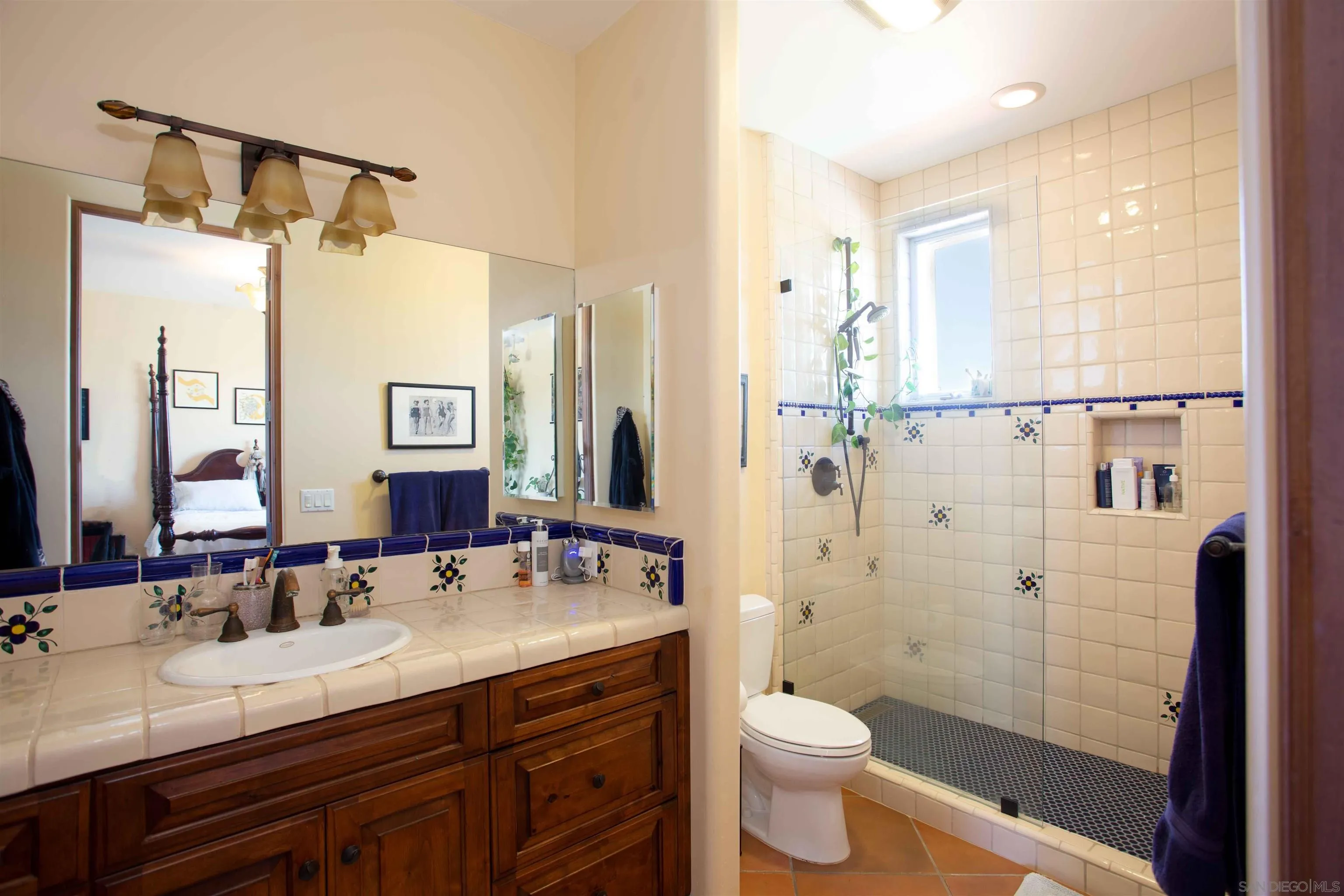 2624 Lone Jack Road Encinitas, CA 92024 - Photo 20 of 37 a bathroom with a granite countertop sink toilet and shower