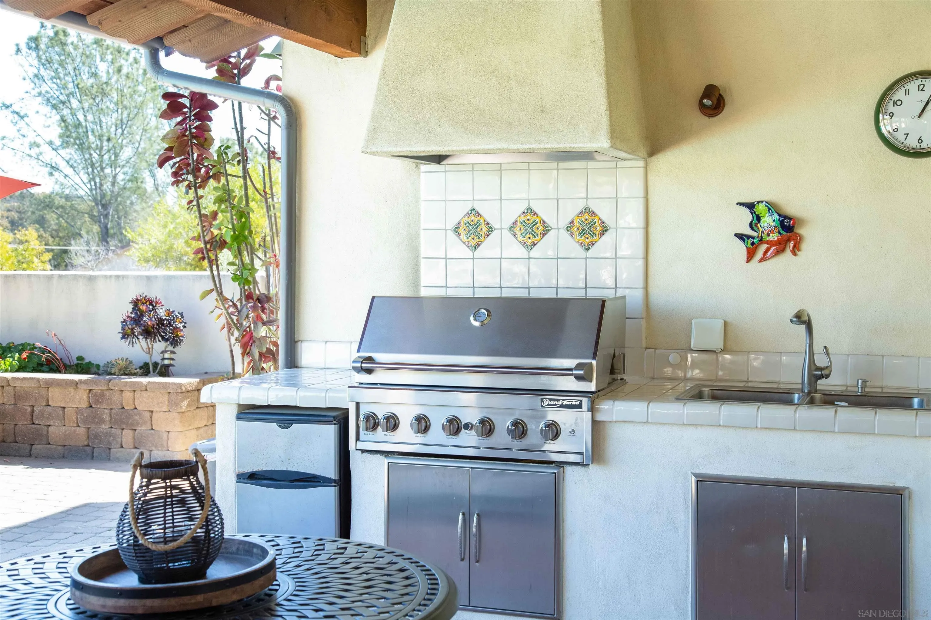 2624 Lone Jack Road Encinitas, CA 92024 - Photo 27 of 37 a stove top oven sitting inside of a kitchen