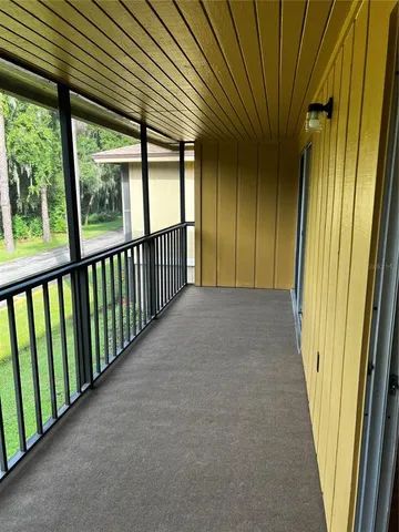 a view of a yard from a balcony