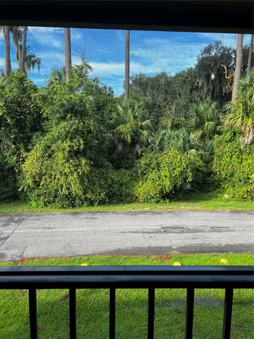 a view of a swimming pool and a yard