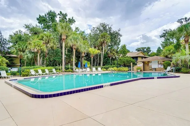 a view of a house with a tree