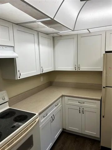 a view of a storage and utility room with cabinets