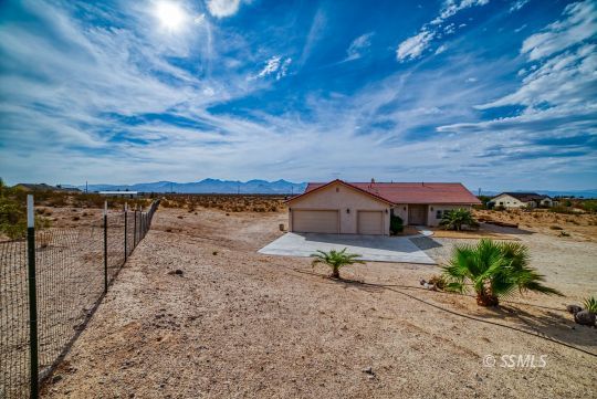 411 North Nolan Street Ridgecrest, CA 93555 - Photo 39 of 43 a view of a backyard and a yard
