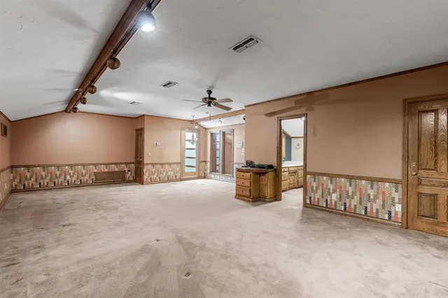 a view of a livingroom with a ceiling fan and a couch