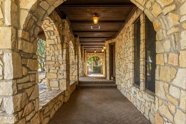 a view of entryway with a front door and wooden floor