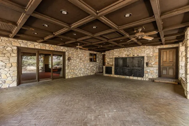 a view of an empty room with a fireplace