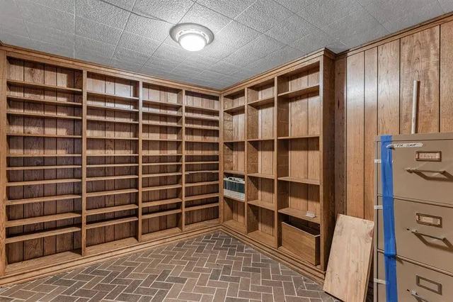 a view of empty room with a large window