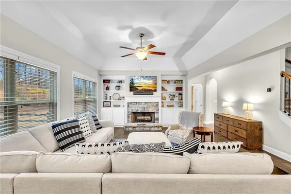 a kitchen with stainless steel appliances granite countertop a stove top oven a sink and a refrigerator