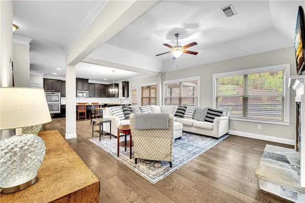 a kitchen with granite countertop a table and chairs in it