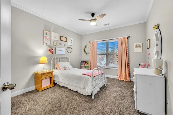 a bedroom with furniture and a window