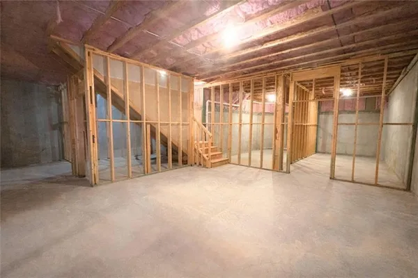 a spacious bathroom with a double vanity sink toilet mirror and shower