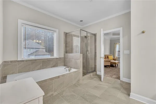 a bathroom with a bathtub and a shower