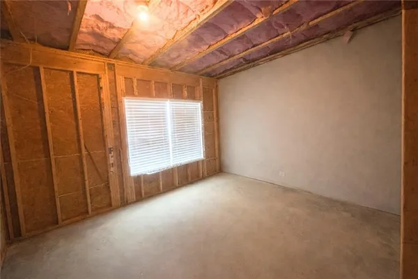 a view of a two chairs and table on the wooden floor