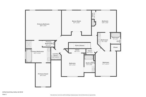 a view of a white house with a large windows and a yard with plants and large trees