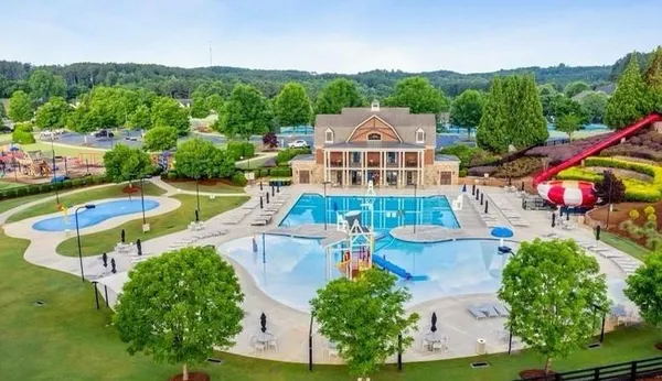 an aerial view of a house with a big yard