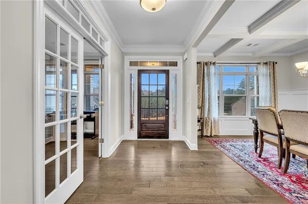 a view of a dining room with furniture window and wooden floor