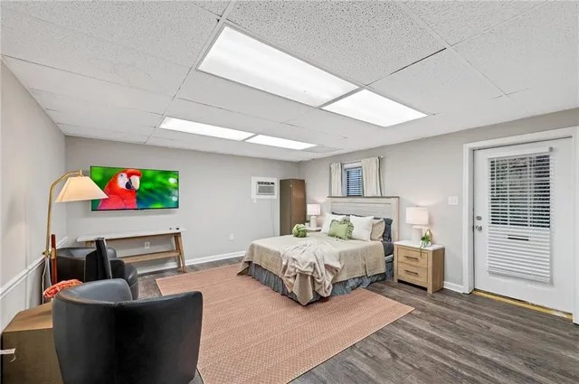 a bedroom with bed and flowerpot