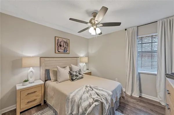 a bedroom with a large bed and a window