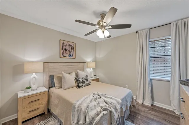 a bedroom with a large bed and a window