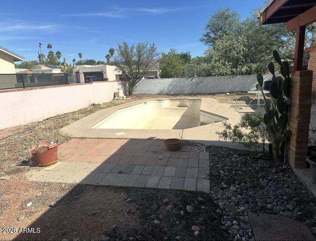4260 West Mars Street Tucson, AZ 85741 - Photo 11 of 15 a view of a swimming pool and lounge chair
