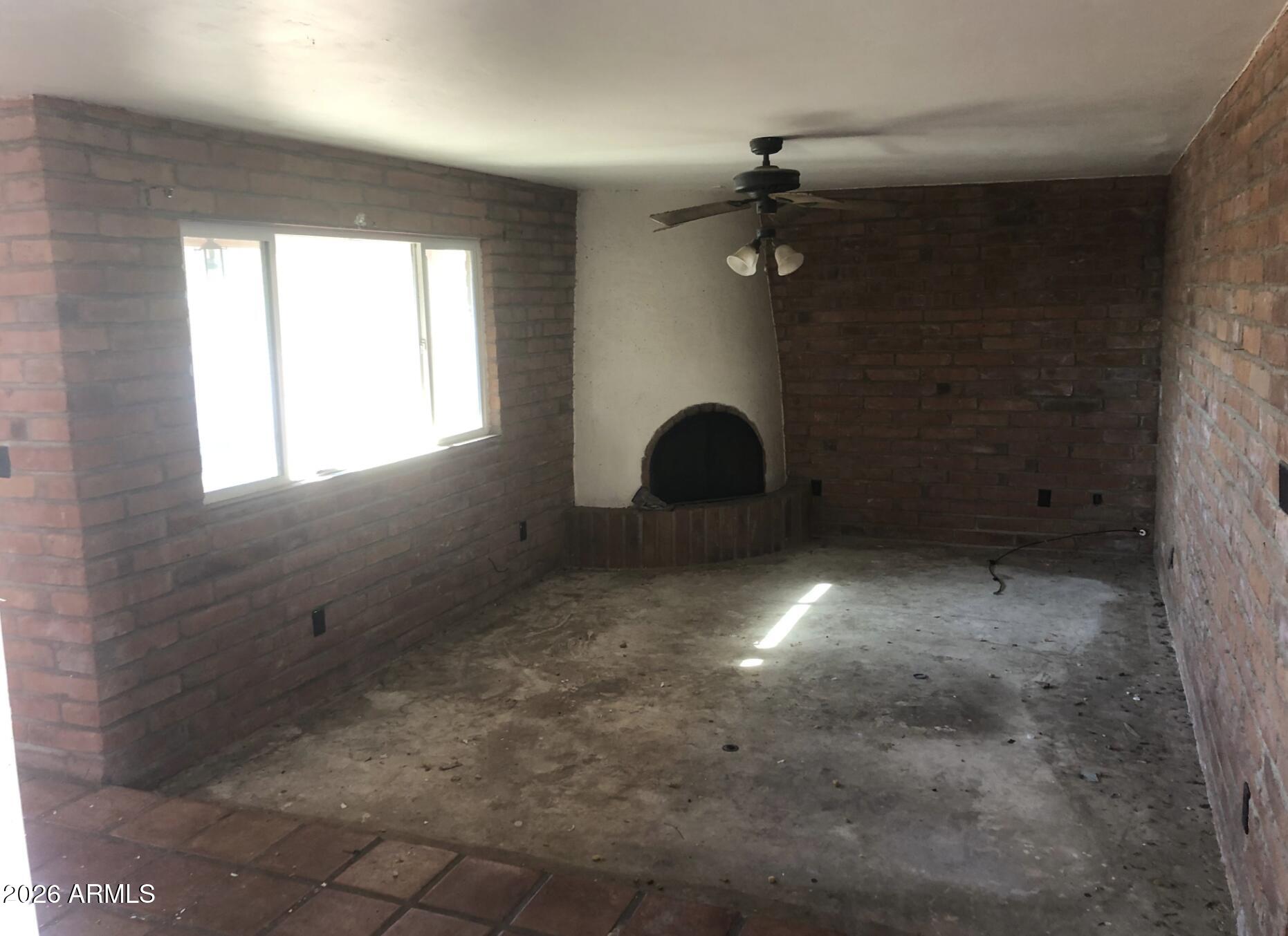 4260 West Mars Street Tucson, AZ 85741 - Photo 7 of 15 a view of a livingroom with a fireplace