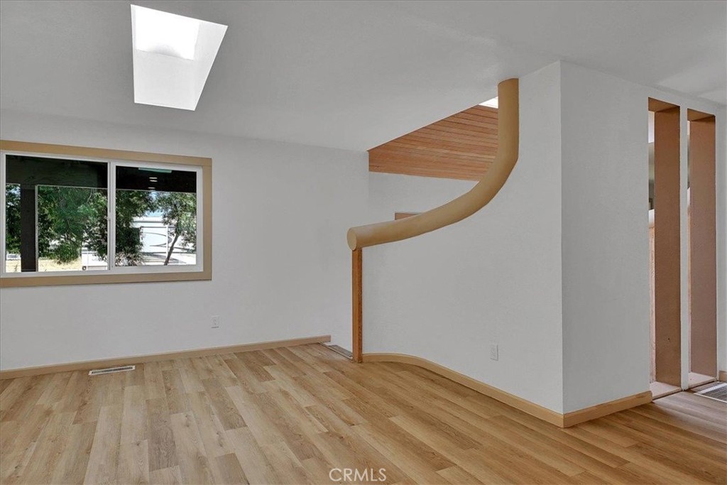 1732 Wescott Road Colusa, CA 95932 - Photo 13 of 56 a view of an empty room with wooden floor and a window