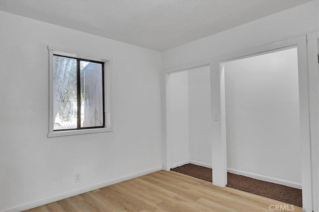 1732 Wescott Road Colusa, CA 95932 - Photo 27 of 56 an empty room with wooden floor and windows
