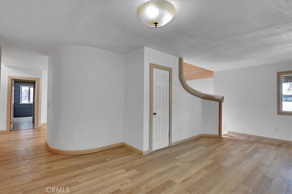 1732 Wescott Road Colusa, CA 95932 - Photo 41 of 56 an empty room with wooden floor and windows